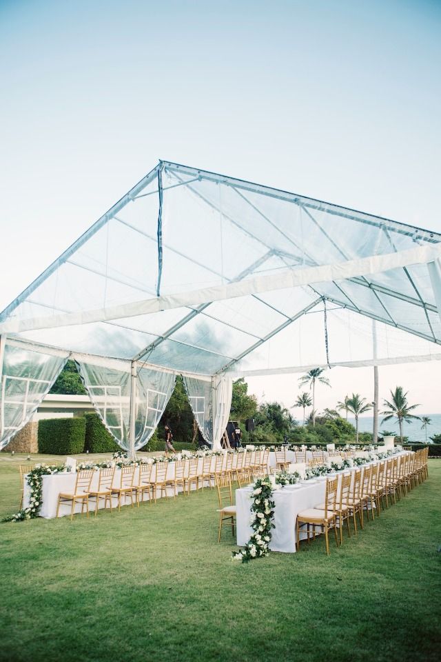 an outdoor venue set up with chairs and tables