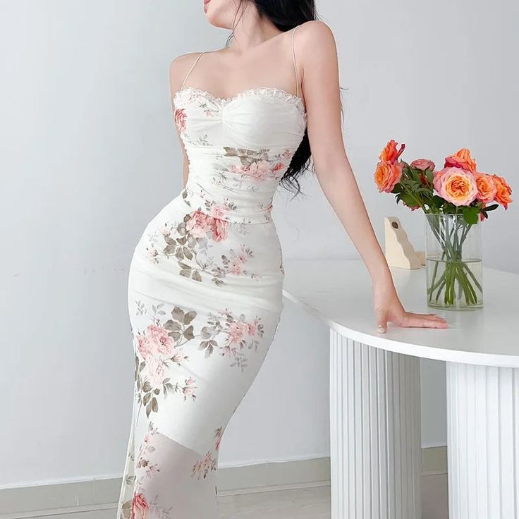 Presenting our exquisite Spring Breeze Midi Bodycon Dress with its enchanting floral print design. This dress showcases a flirtatious sweetheart neckline accompanied by thin spaghetti straps to add a modern twist. Made with a sheer outer fabric that floats to midi length, offering a tantalizing glimpse without giving too much away. Its silhouette fitting design accentuates your curves, offering a sense of allure and intrigue. Color: White / BlackSilhouette: SheathLength: MidiMaterial: PolyesterP Beige Bodycon Sleeveless Dress For Summer, Summer Bodycon Sleeveless Dress In Beige, فستان زهري, Girls In Suspenders, Midi Dress Chic, Backless Midi Dress, Office Dresses For Women, Long Midi Dress, Suspender Dress