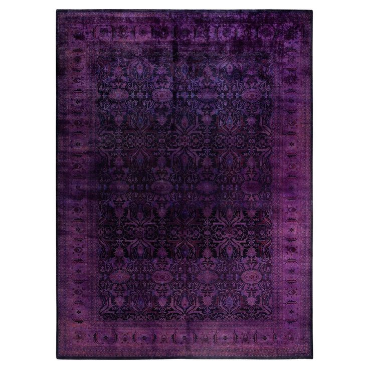 a purple rug with an intricate design on the front and back side, in various colors