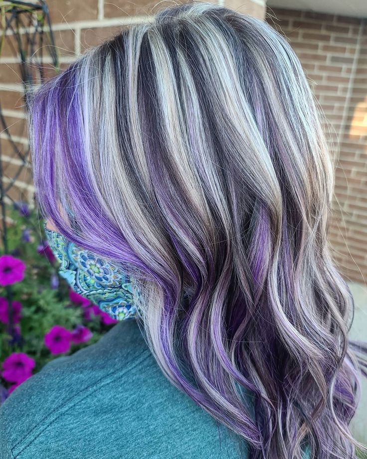 Ever thought that purple and silver shades can go well together? Kaitlyn Jeanne, an independent stylist in Wheaton, IL made it work, resulting in a one-of-a-kind hair color idea! Get more purple silver hair trends from our website. #silverpurplehair #silverandpurplehair Silver Hair With Lavender Highlights, Purple Silver Highlights, Black Grey And Purple Hair, Gray And Color Hair, Gray Hair With Purple Highlights Silver, Purple Lowlights In Grey Hair, Purple Highlights Grey Hair, Blonde Highlights With Purple Lowlights, Hair Color Ideas With Grey