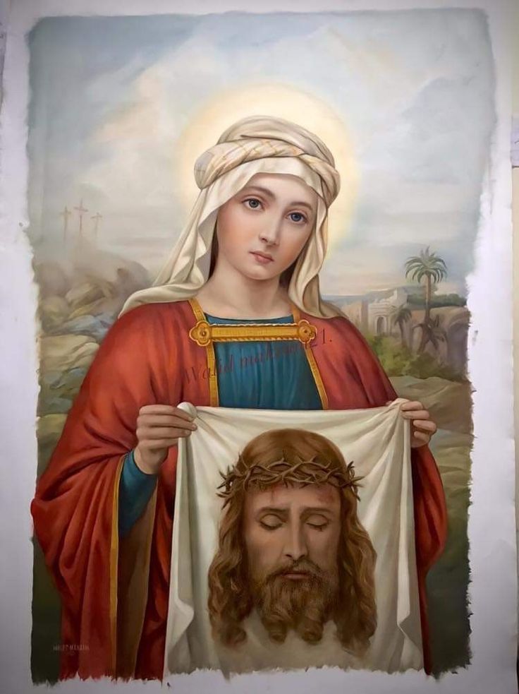 the icon of jesus holding up a cloth with an image of jesus on it's chest