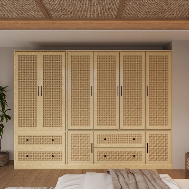 a bed sitting under a wooden ceiling next to a wall mounted cabinet with drawers and doors