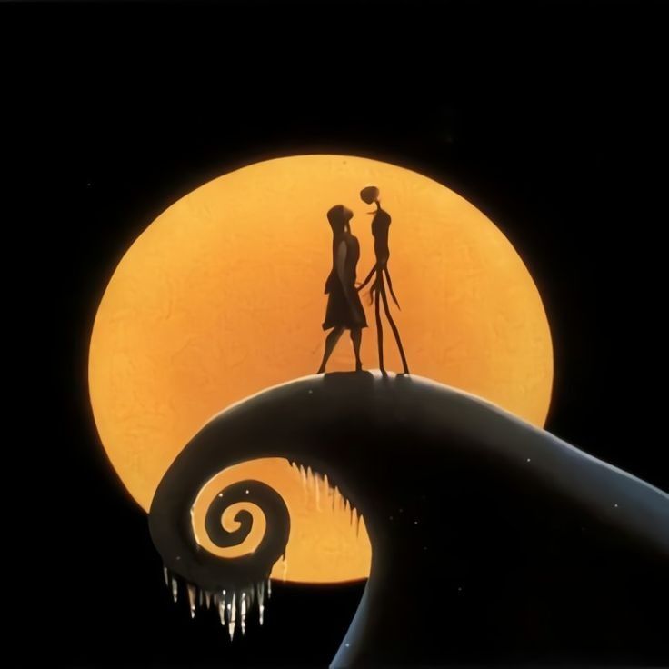 two people standing on top of a wave in front of the moon with icicles