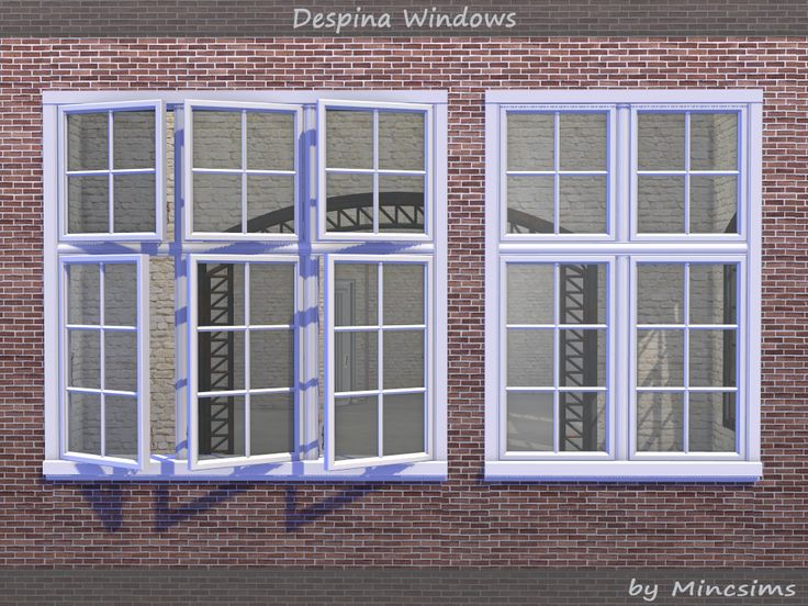 a brick building with three windows on each side and the words despima windows above them