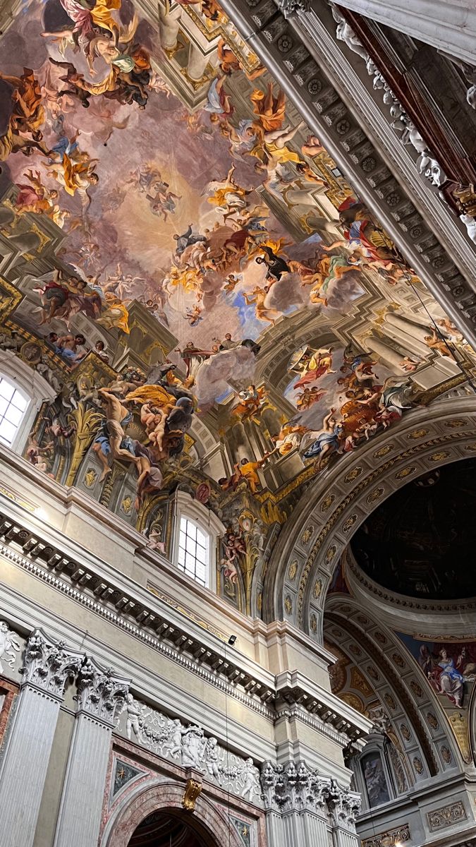 an ornate ceiling with many paintings on it