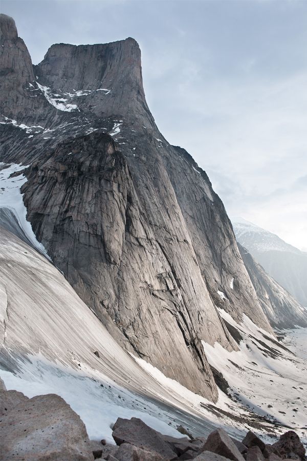 the mountain is covered in snow and rocks