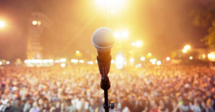 a microphone in front of a large crowd