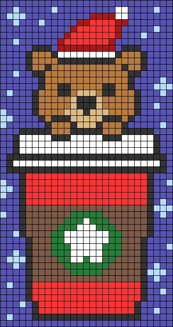 a cross stitch pattern with a teddy bear in a santa hat on top of a cup