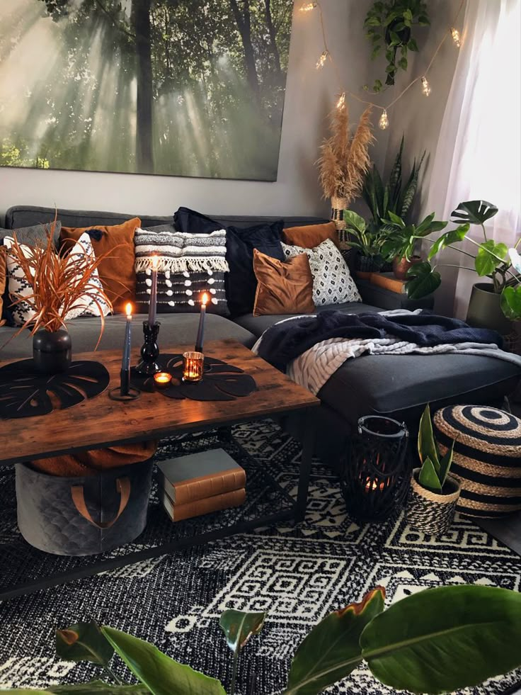 a living room filled with lots of furniture and plants