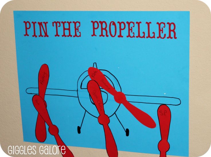 a blue and white sign with red writing that says pin the propeller