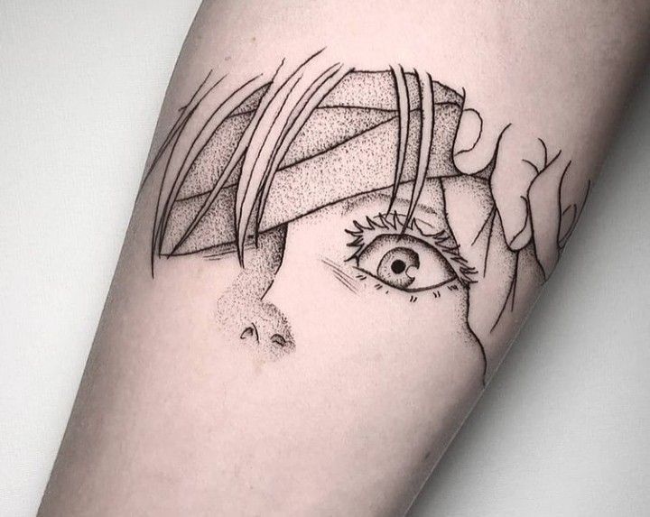 a woman's arm with a black and white drawing of an eye on it