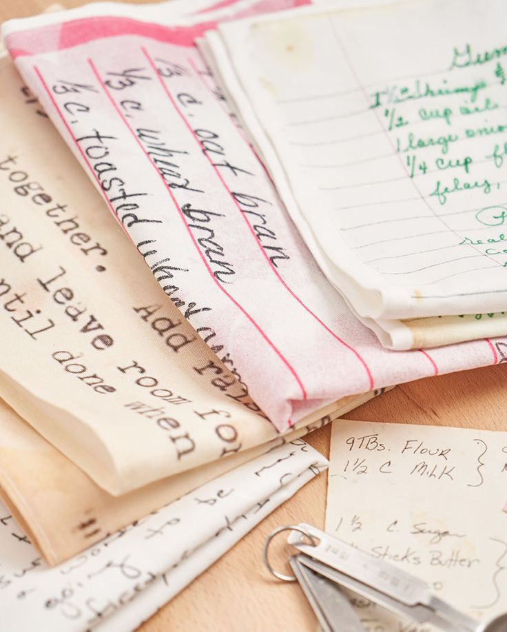 several papers and keys on a table with some type of paper attached to the handles