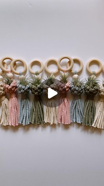 a video demonstrating how to make tassels with yarn and pine cones for wreaths