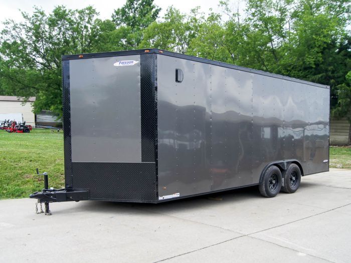 The 8.5-foot by 20-foot charcoal grey enclosed trailer with blackout package features two greaseable 5,200lb axles, wired LED drive lights, and a spring-assisted loading ramp. Enclosed Trailer, Loading Ramps, Enclosed Trailers, The 8, Vehicle Parts, Charcoal Grey, Trailer, Drive, Packaging