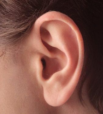 a woman's ear is shown in close up