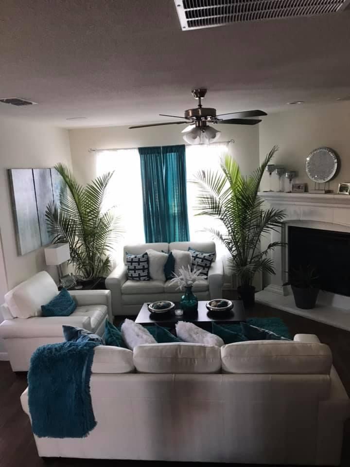 a living room filled with furniture and a fire place