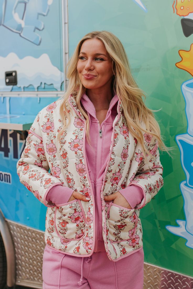 Blossom with style in THE CHANDLER QUILTED JACKET! Boasting a vibrant pink floral design, this open jacket is both cute and trendy. Stay warm and fashionable with this quilted jacket that adds a touch of fun to any outfit. Paired with THE ANEESA LOUNGE SET IN PINK Long sleeve Buttonless Front pockets Quilted Floral printed 100% polyester Runs true to size. Small (0-4), Medium (6-8), Large (10-12). Model is 5'7" wearing a size small. Check out our try-on video! Casual Winter Outerwear With Floral Patchwork, Casual Floral Patchwork Outerwear For Winter, Jacket With Belt Outfit, Quilted Long Sleeve Spring Outerwear, Casual Floral Patchwork Outerwear For Spring, Spring Cotton Puffer Jacket With Pockets, Spring Long Sleeve Quilted Puffer Jacket, Spring Cotton Quilted Jacket, Spring Cotton Quilted Outerwear