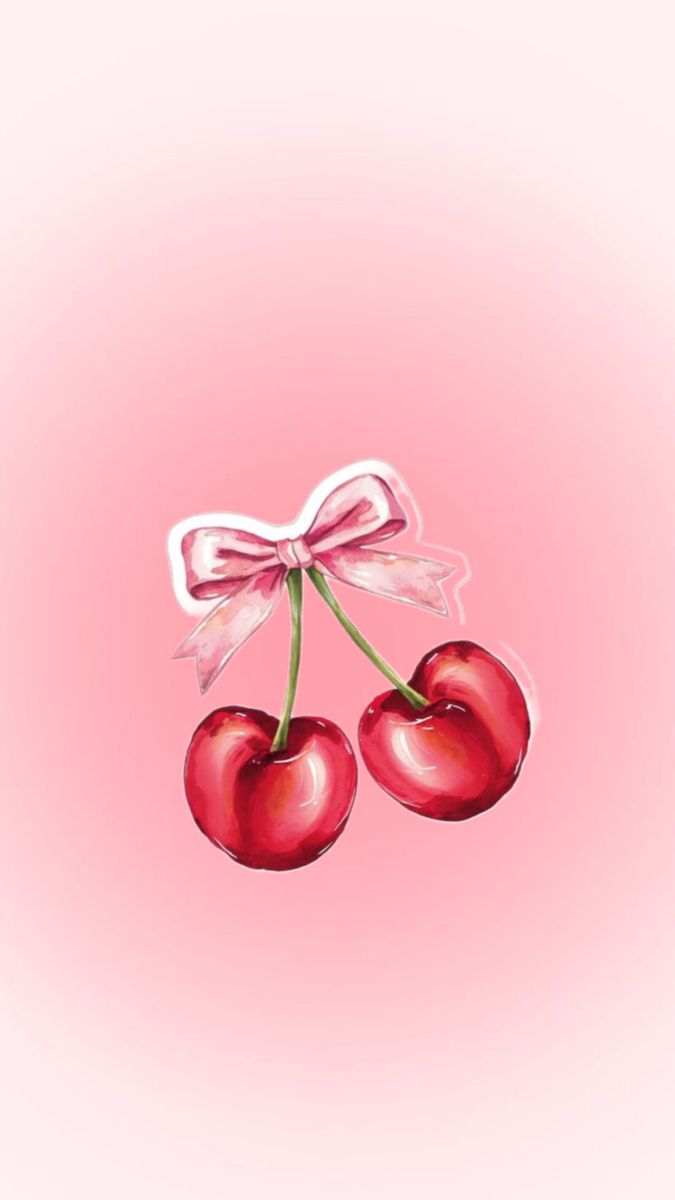 two cherries tied to a bow on a pink background