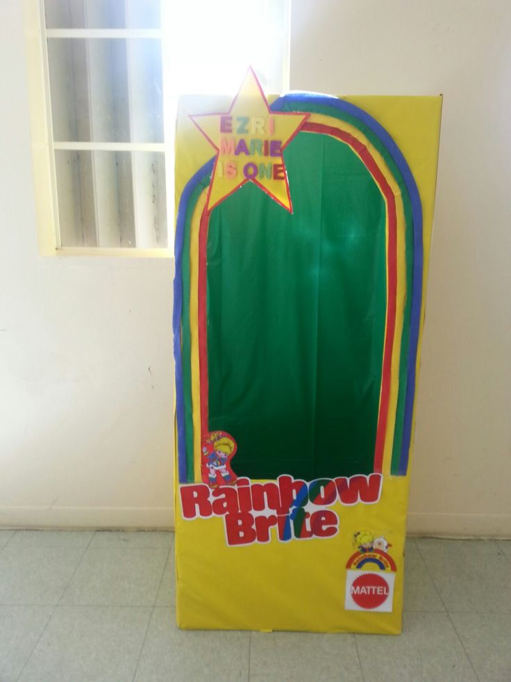 a cardboard rainbow briee with the door open