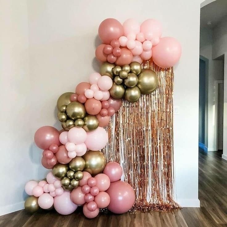 a bunch of balloons that are on the wall