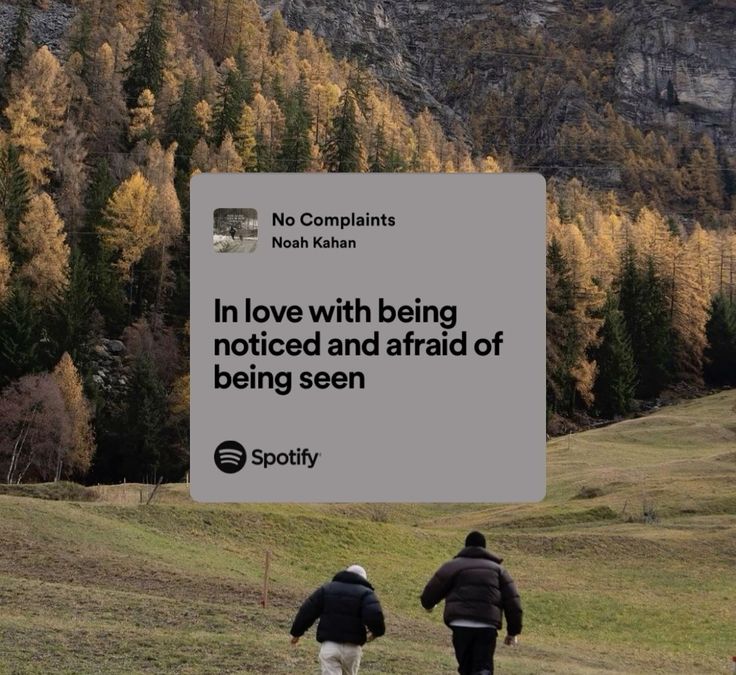 two people walking down a hill with trees in the background and a quote written on it