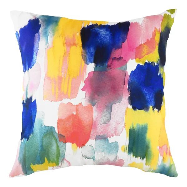 a colorful pillow with watercolor paint on it