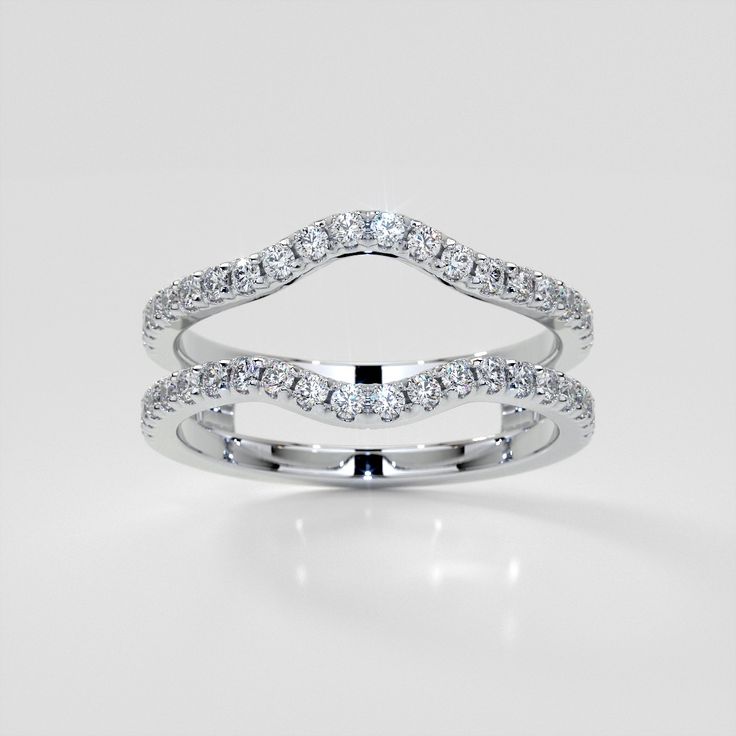 a white gold wedding ring with diamonds on the sides and an open band in the middle