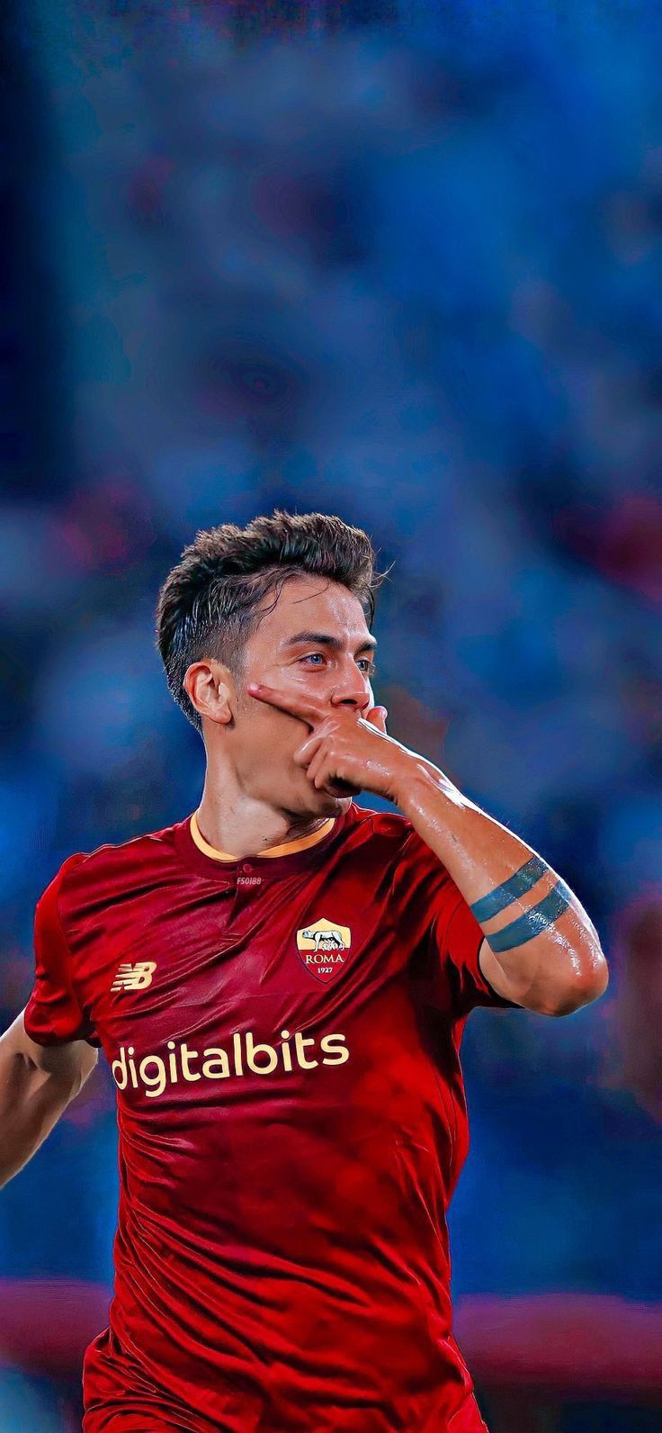 a soccer player with his hand on his face