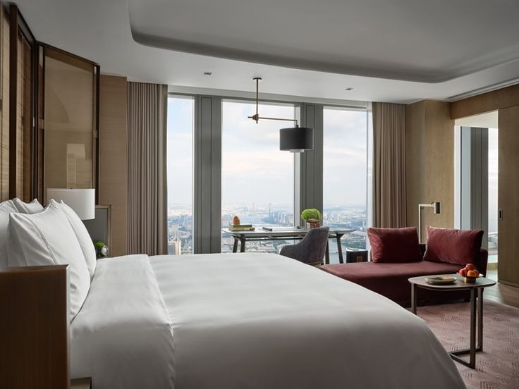 a hotel room with a view of the city