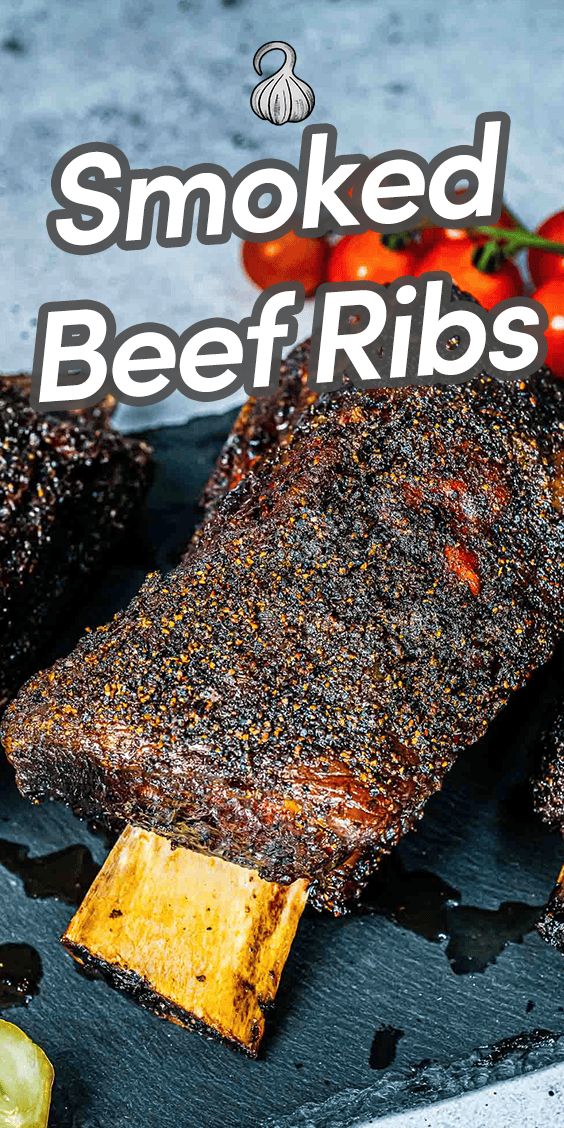 smoked beef ribs on a cutting board with tomatoes and peppers in the background text reads smoked beef ribs