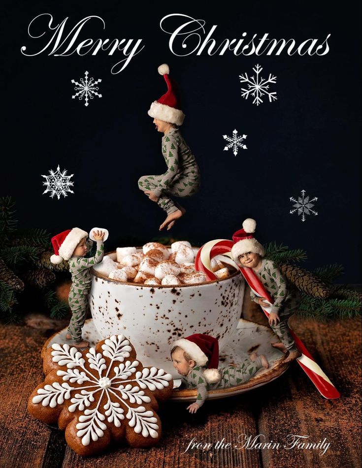 a merry christmas card with elves in a teacup and snowflakes on the table