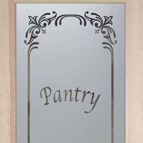 the word pantry is etched into a glass door with an ornate frame and border around it