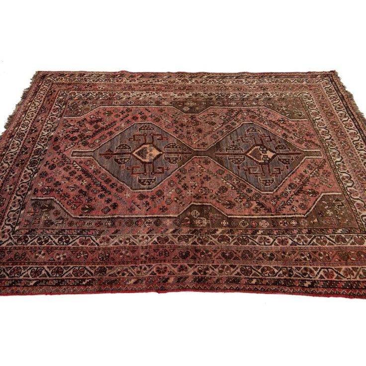 an antique persian rug is shown on a white background