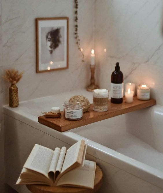 a bath room with a book and candles