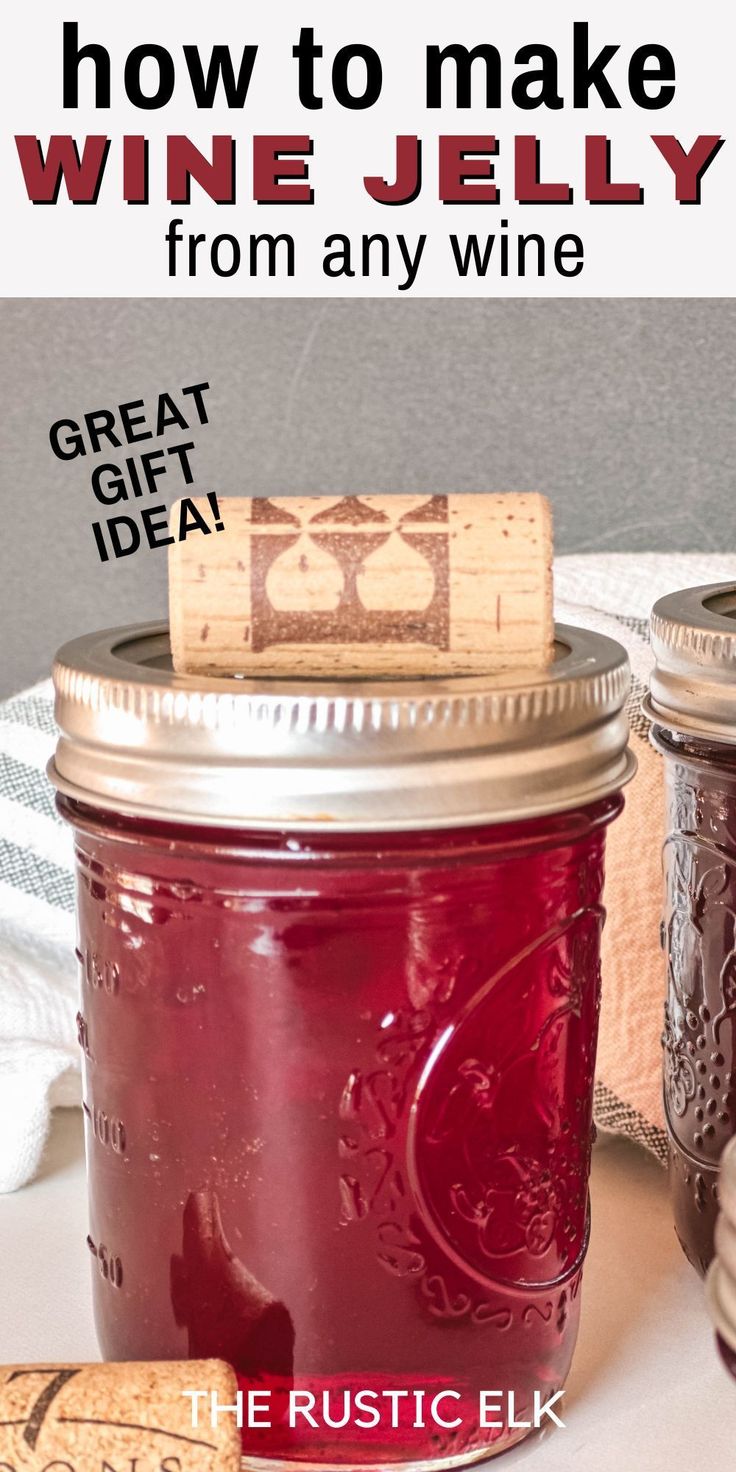 two jars filled with red wine sitting on top of a table next to corks