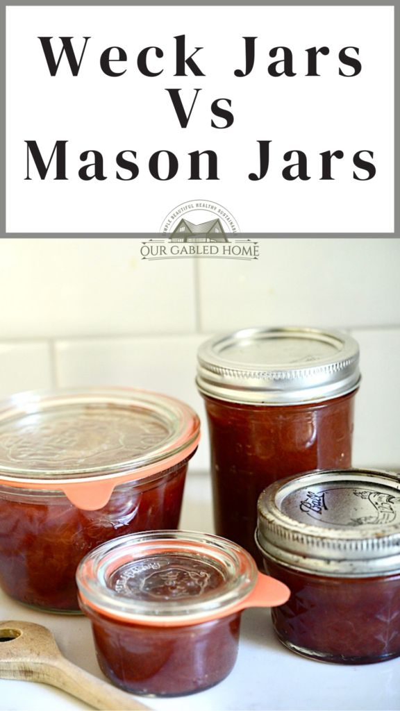 three jars of jam sitting on top of a counter