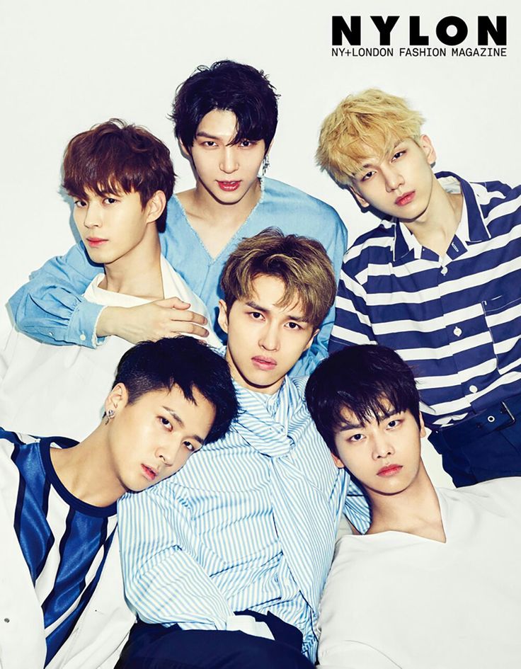 the cover of nylon magazine featuring six young men in blue and white striped shirts, one with