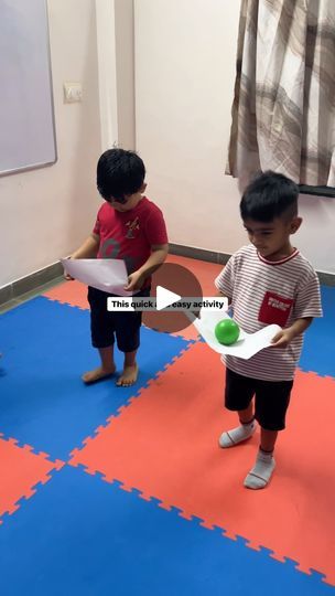 two young children playing with toys in a room