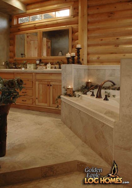 a large bathroom with wooden walls and flooring