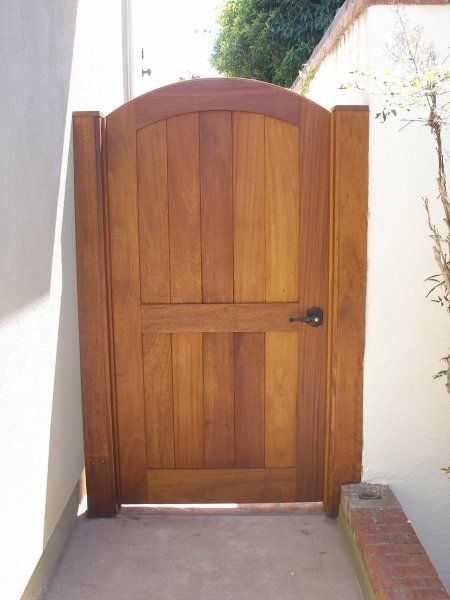 an open wooden door with brick steps leading up to it