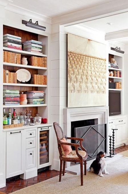 a living room filled with furniture and a fire place