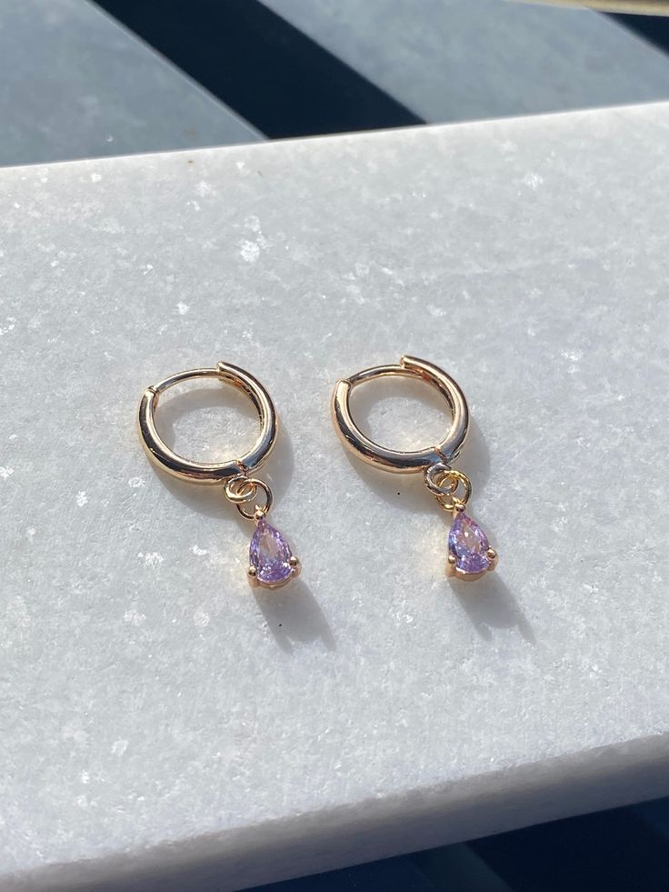 Brand new  💕Handmade by yours truly  Beautiful high quality and lead free. Huggies, charm and all findings are 18K gold plated and tarnish resistant.  COLOURGold  SIZE0.8x0.5cm Charm 2.5cm TL Material18K Plated Gold Brass Weight1.9g 💌Price includes free untracked shipping within Australia *These earrings are made to sit side facing. Please refer to try on picture. **These huggies have an 1mm thick ear pin which may not be be suitable for those who don't wear earrings often or are only used to Rose Gold Teardrop Hoop Earrings Gold Plated, Trendy Teardrop Huggie Earrings Gift, Lilac Earrings, Ear Pin, Ear Pins, Purple Earrings, Dangly Earrings, Lilac Purple, Gold Brass