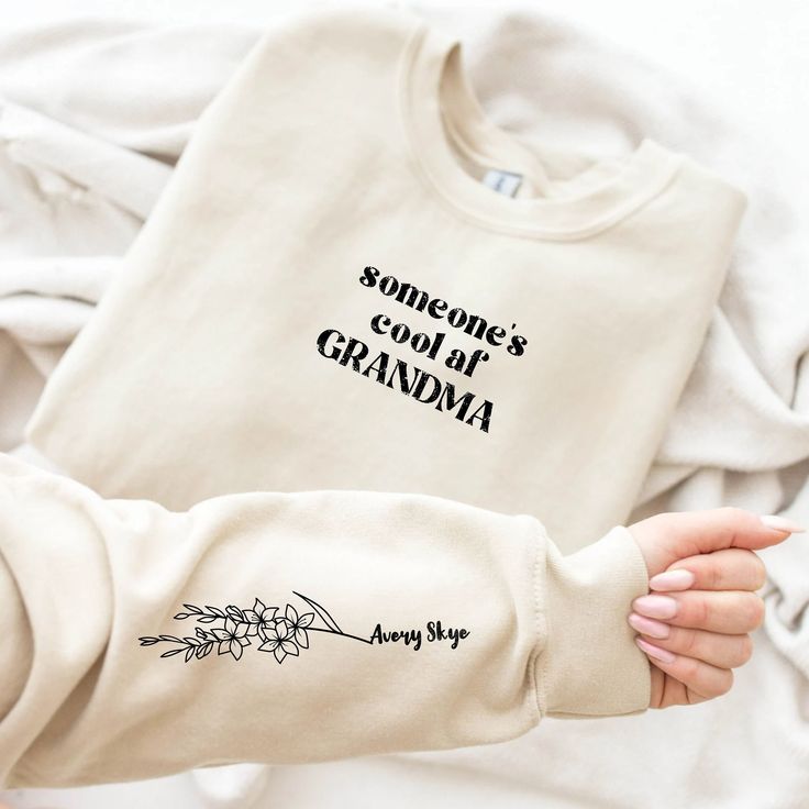 someone's cool off grandma sweatshirt with flowers on the front and back in black ink