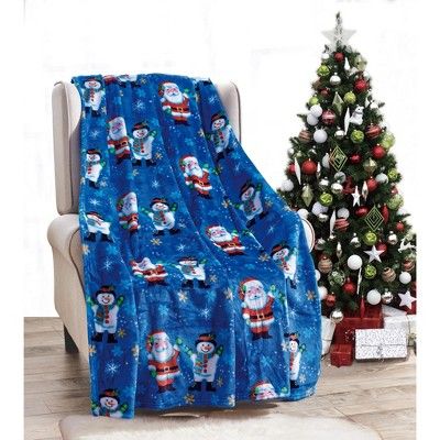 a blue christmas blanket sitting on top of a chair