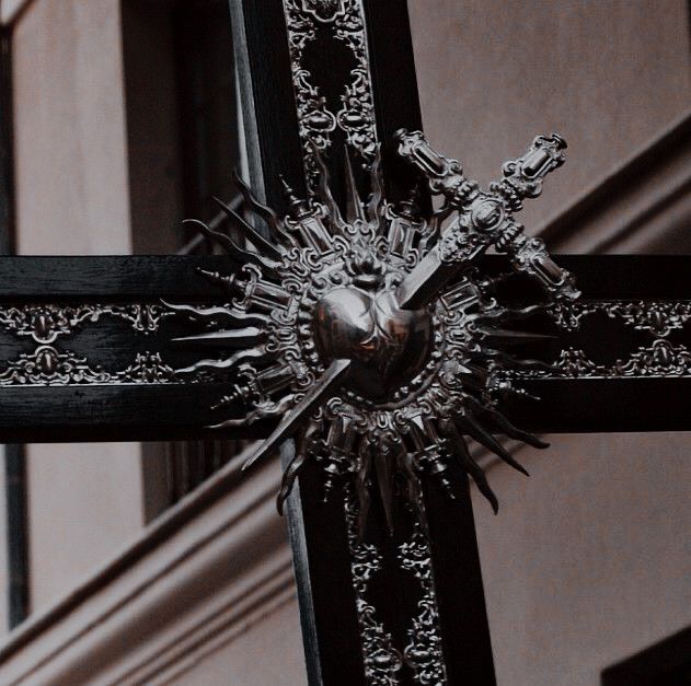 the cross is decorated with intricate designs