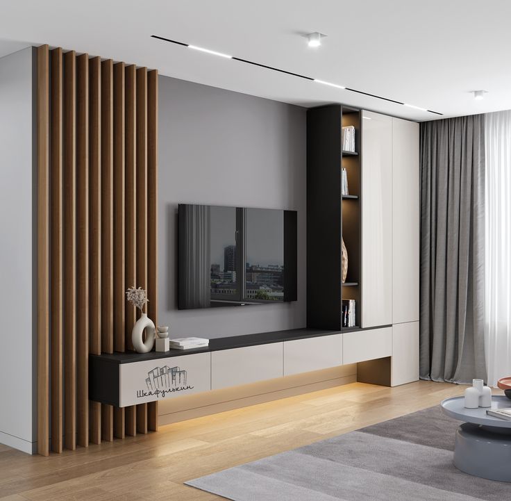 a modern living room with wooden slats on the wall and large screen tv in the center