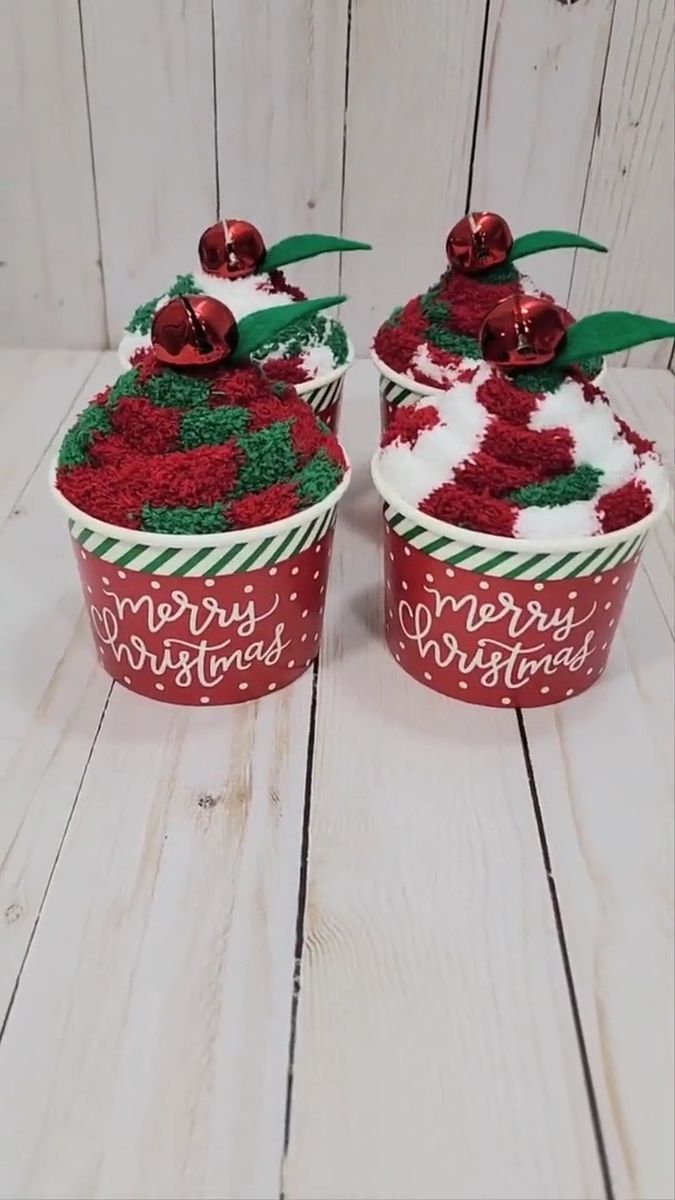 two cupcakes decorated with red and white frosting