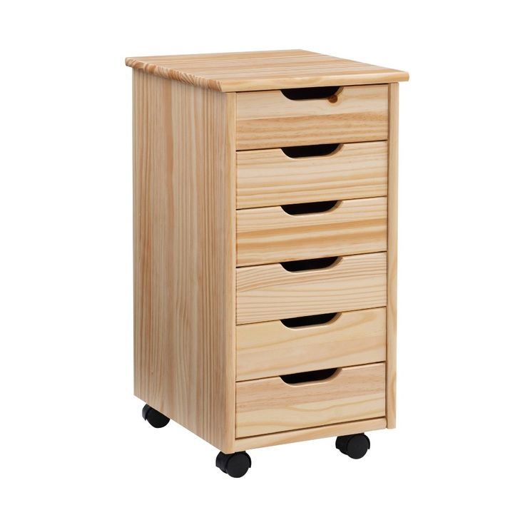 a wooden cabinet with four drawers on wheels