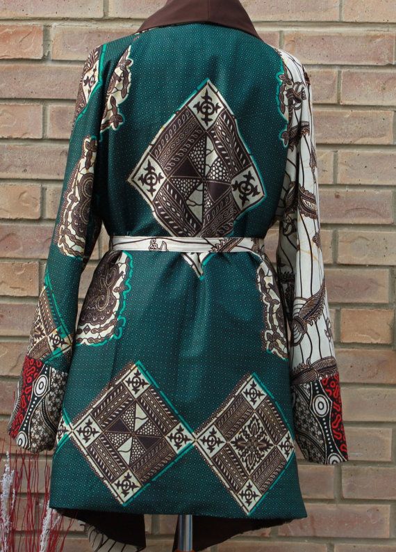 A unique three African print jacket. This stylish jacket is loose fitting, fully lined to keep you warm and very comfortable  Jacket has no closure( Belt included), big raglan long sleeves and waterfall collar. Available in 5 sizes  SMALL- (8-10) uk sizes  MEDIUM- (12-14)  LARGE (16-18)   X-LARGE (20-22)   XX-LARGE (24-26)   Can be made in other prints please enquire to see what prints we have in stock. Patterned Long Sleeve Patchwork Outerwear, Vintage Long Sleeve Patchwork Kimono, Vintage Long Sleeve Printed Kimono, Vintage Printed Long Sleeve Kimono, Bohemian Long Sleeve Printed Cardigan, Vintage Long Sleeve Kimono With Patchwork, Bohemian Long Sleeve Brown Kimono, Bohemian Brown Long Sleeve Kimono, Winter Printed Long Sleeve Kimono