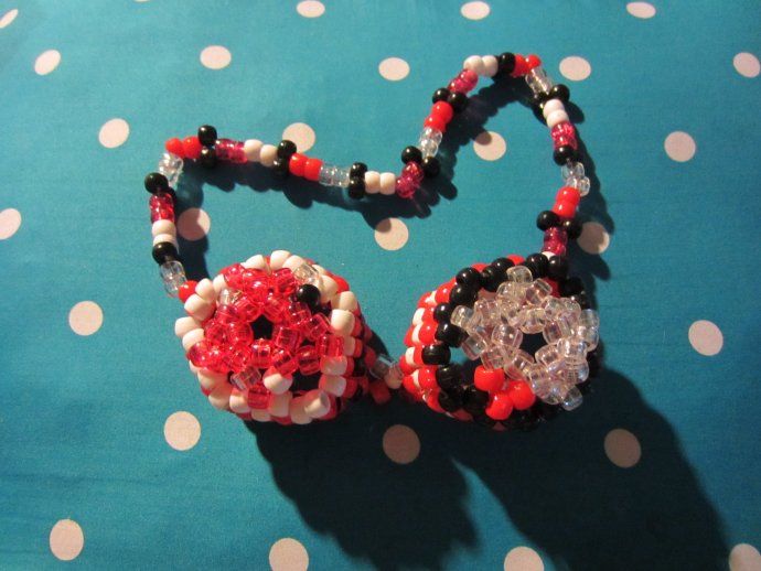 a necklace made out of beads on a polka dot tablecloth